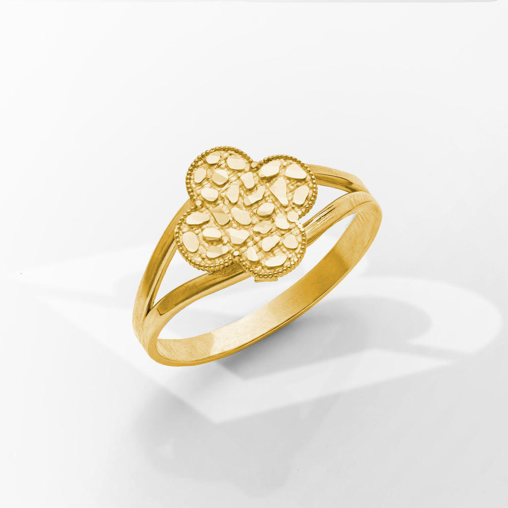 Gold ring with a textured design on a white background