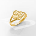 Gold ring with a textured design on a white background
