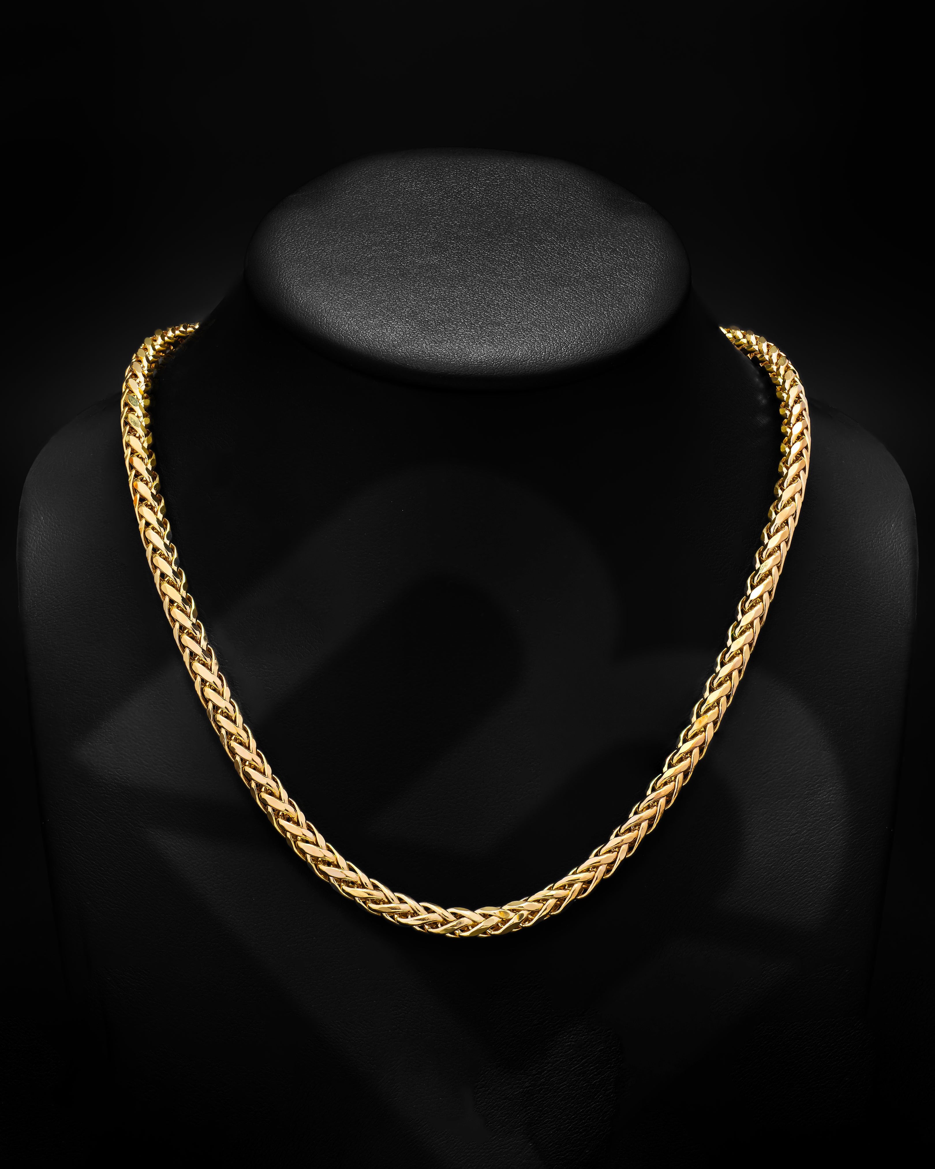 14 karat gold necklace over a black neck display